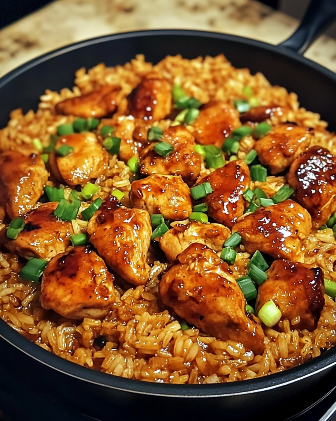 One-pot sweet and spicy sticky teriyaki chicken and rice in skillet